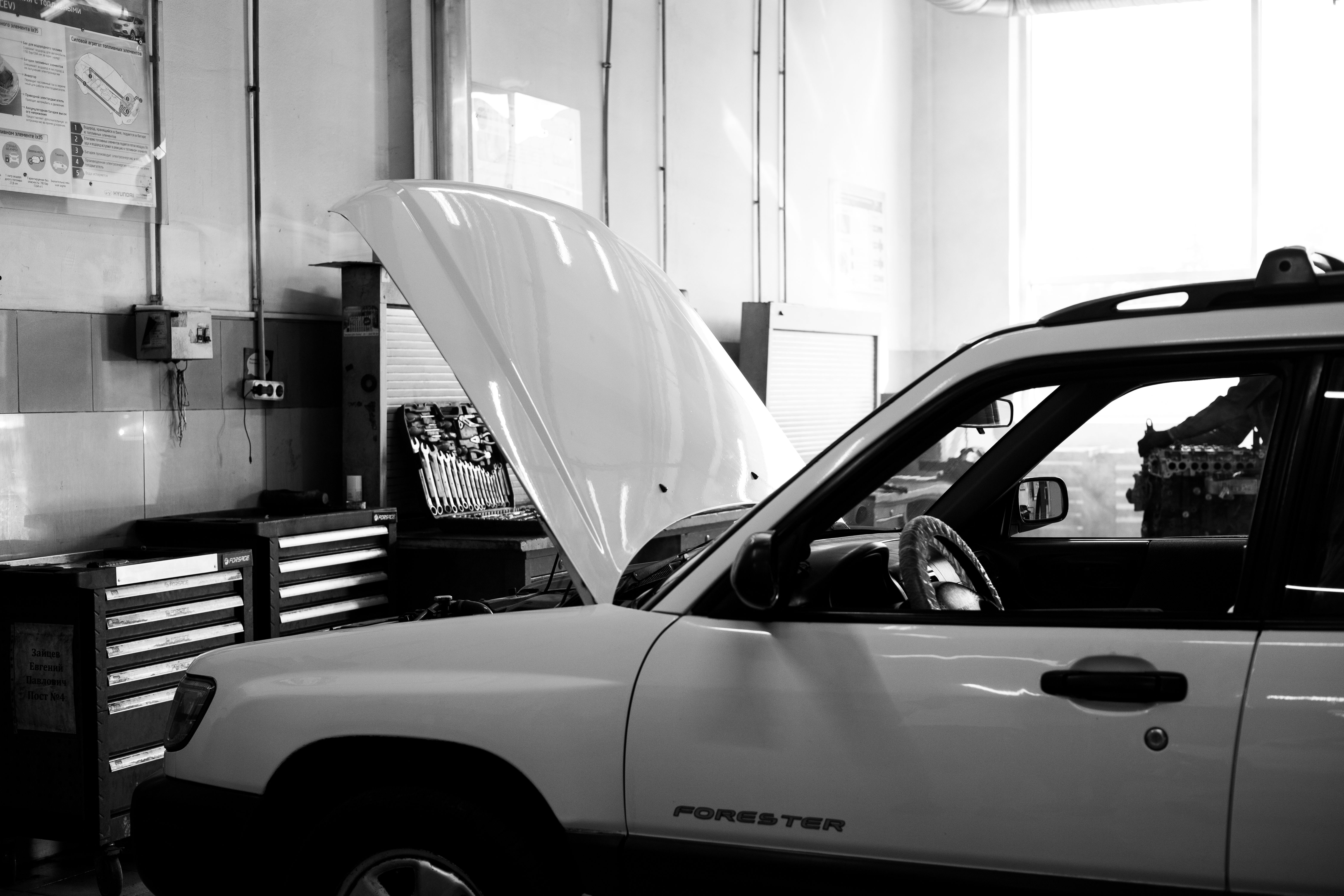 Professional automotive equipment service technician at work